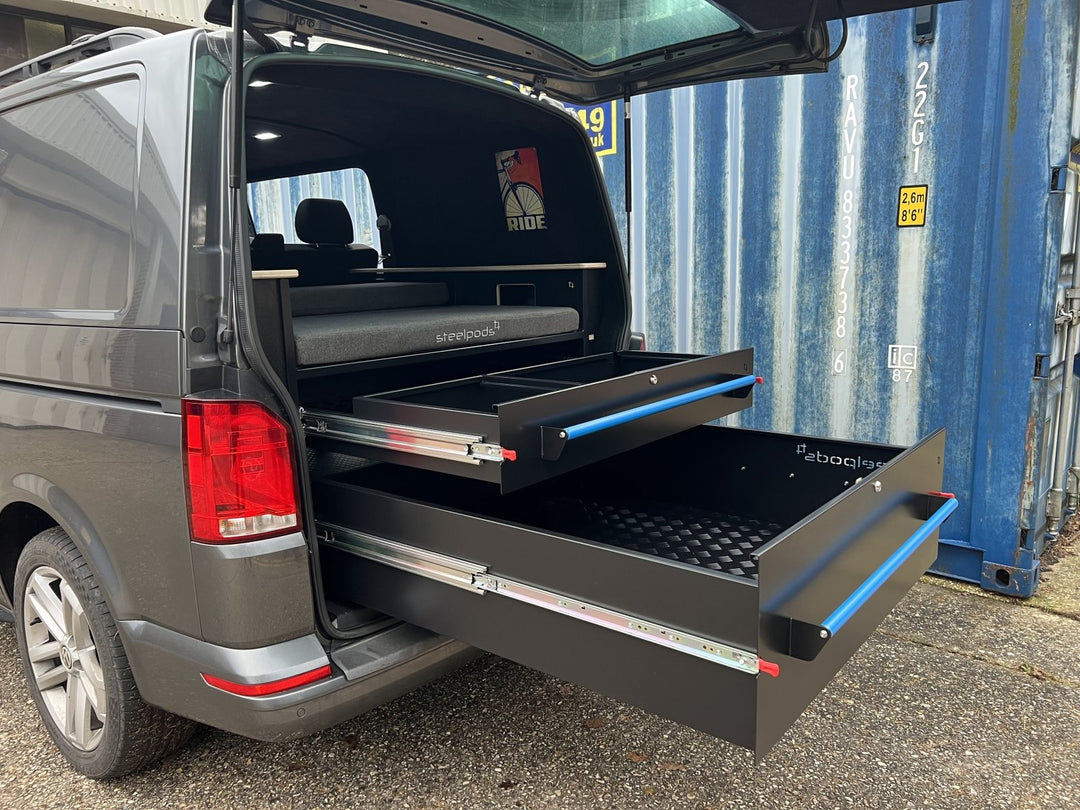 Twin steel drawers in a kombi van with coloured handles
